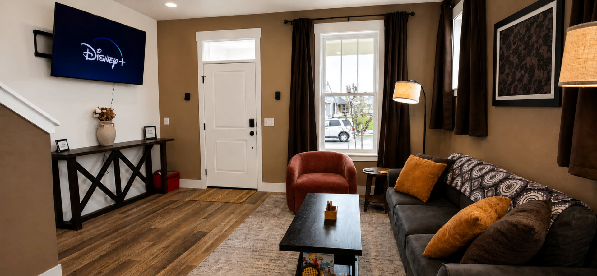 Warm, walnut-toned living room of Mocha Haven furnished stay